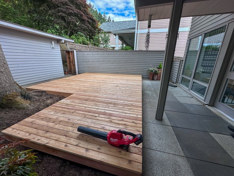 Cedar deck install with black railing in Puyallup Washington backyard